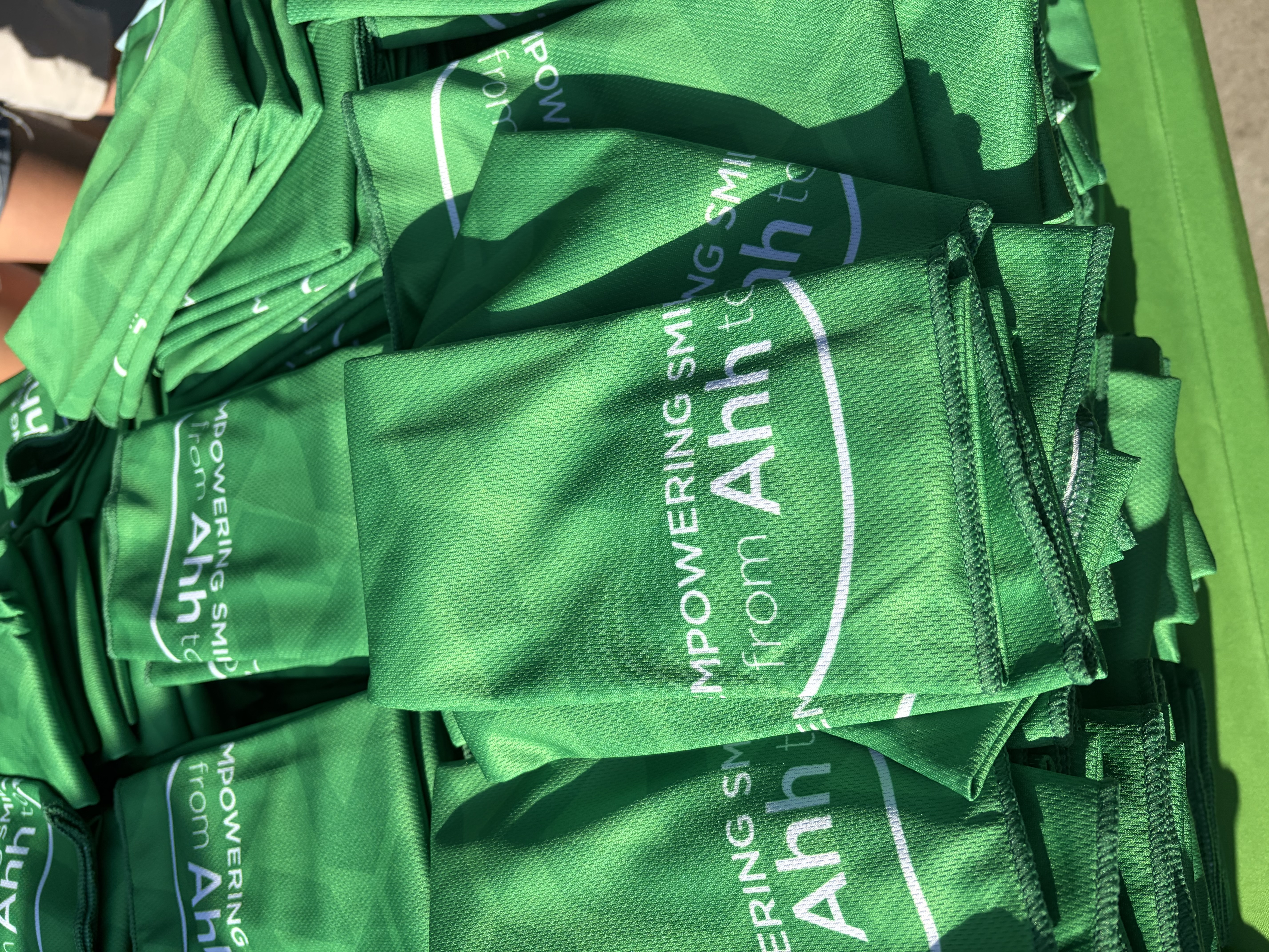 Delta Dental green towels at Run to Home Base